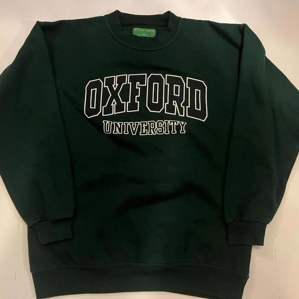 Classic Oxford University crewneck in a dark green colorway.
